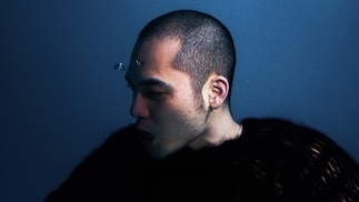 Photo of Tzusing underwater wearing a black sweater