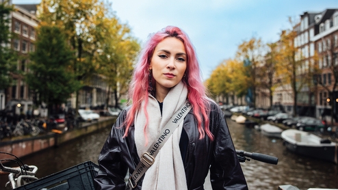 Camden Cox on a bridge in Amsterdam