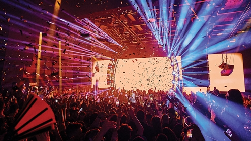 A crowd facing the DJ booth in Hï Ibiza's main room