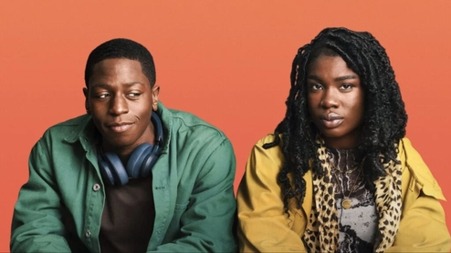 Image of two lead actors in Rye Lane against an orange backdrop