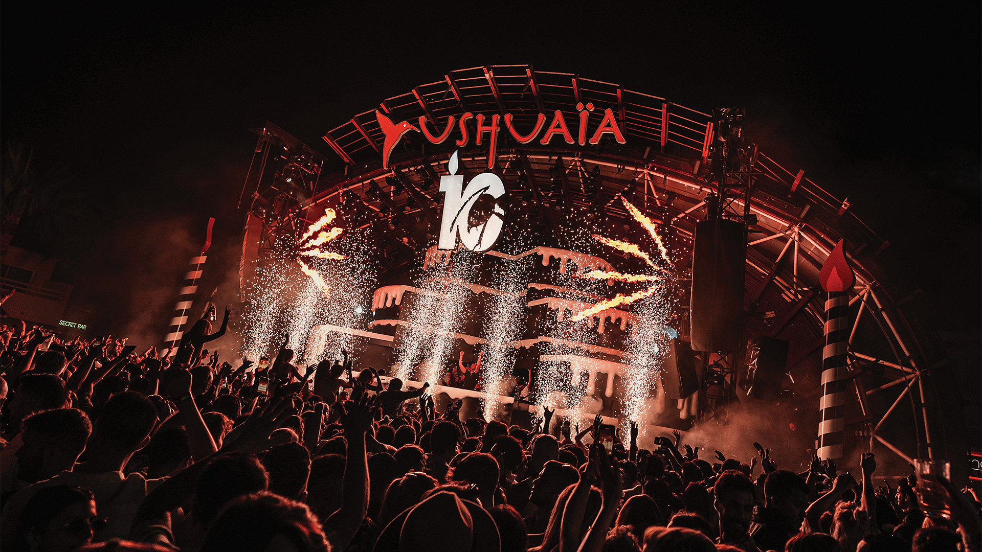 Photo of the Ushuaïa Ibiza stage with red lights and the ANTS 10 celebratory logo